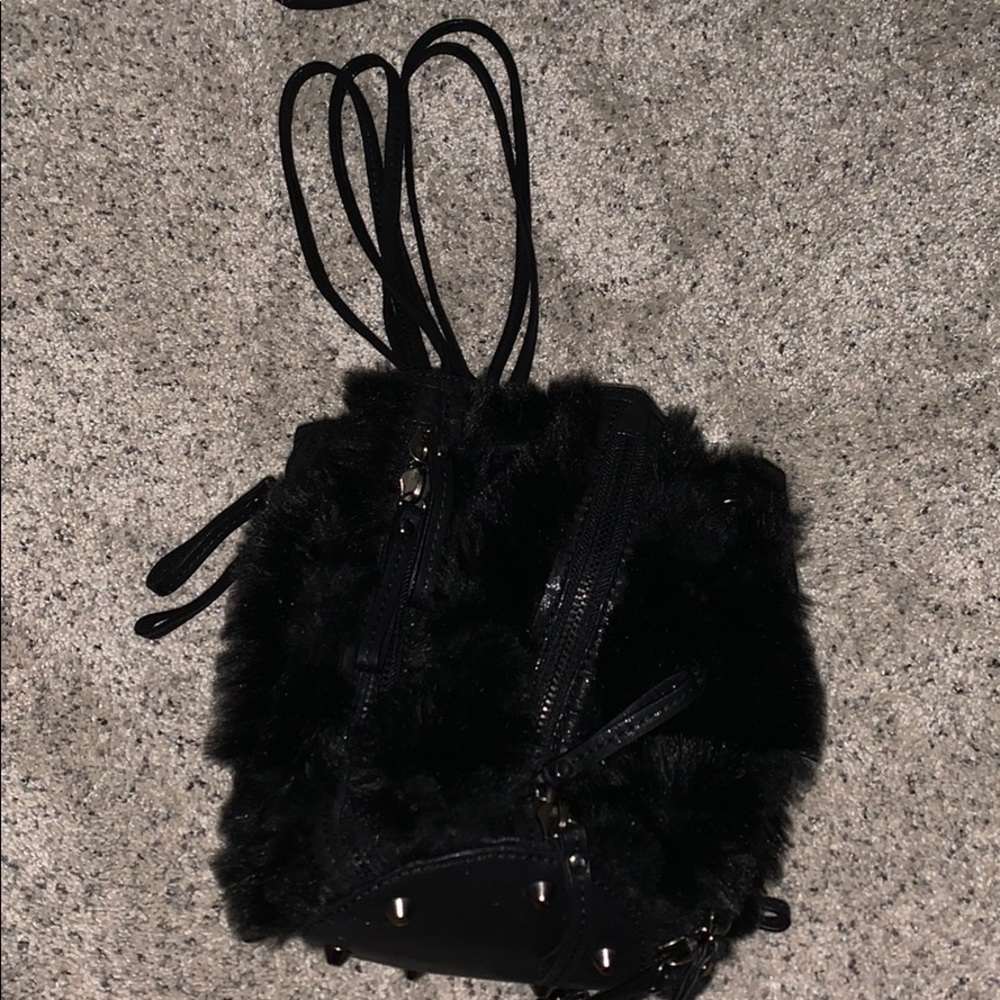 It’s a black drawstring zipper bag